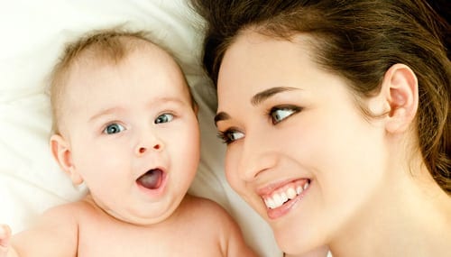 mom lying next to baby