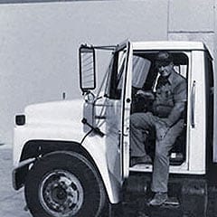 1969 - Man in cab of truck