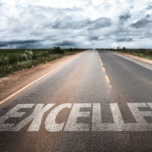 excellence written on roadway